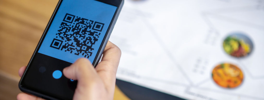 scanning a QR code at restaurant